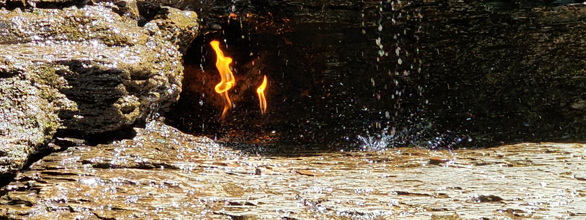 Eternal Flame burns within a waterfall to represent all those who keep the Learnabilities.net fire burning.