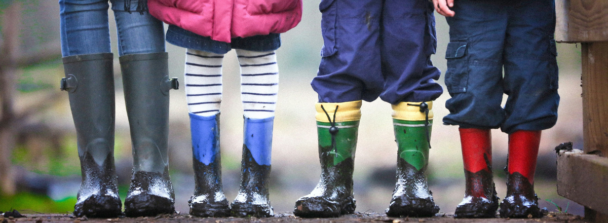 Children wearing varied pants and boots to represent learning differences support through strategies.