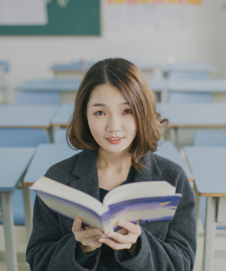 Girl in primary school looking through camera showing student empowerment